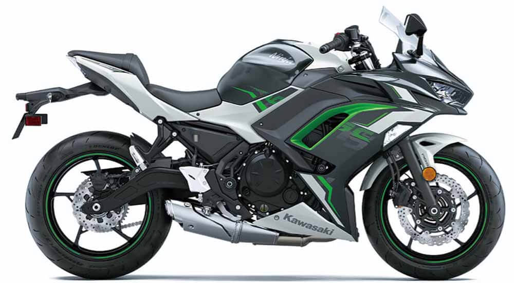 The 2023 Pearl Robotic White/Metallic Matte Flat Raw Graystone/Ebony, a captivating color combination that sets it apart from its 2022 counterpart, the Pearl Robotic White/Metallic Carbon Gray Kawasaki Ninja 650. Nothing short of legendary!