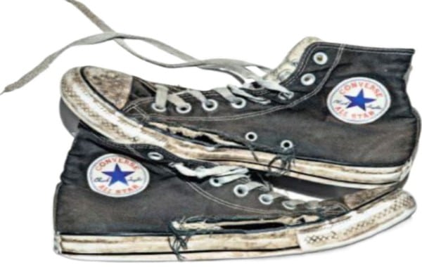 A torn high-top converse shoe, the result of a rider low-siding during a rainy day. He was only going 12-15 mph at the time. Take a look at the damage. Now, imagine if they had been traveling at a more common road speed of 35-50 mph. Aw snap!
