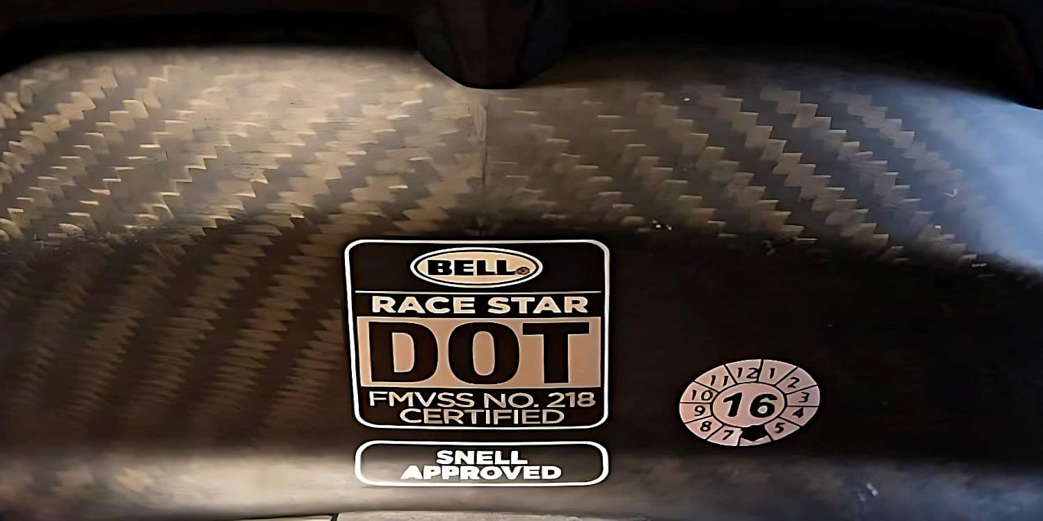 The BELL Race Star helmet showcasing the DOT FMVSS No. 218 and SNELL approved stickers. The SNELL Memorial Foundation tests are stricter than the FMVSS No. 218 tests. While the SNELL tests do not affect what is legal to sell anywhere in the United States, they prove that a helmet goes beyond the usual standard and offers excellent protection.