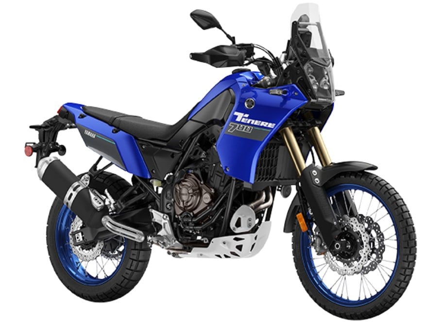The 2024 Yamaha Tenere 700 in all its blue glory traversing the fairings and wheels. It’s narrower and nimbler than the competition (including KTM 790/890). The rugged nature of this bike and its enduro soul can only be compared to the equally athletic but less powerful Aprilia Tuareg 660.